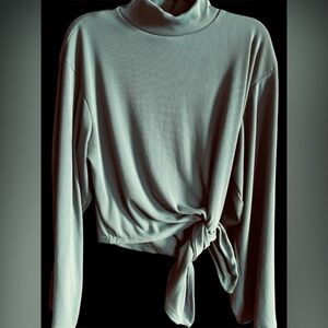 Women's new unbalanced knit sweater in soft sage green. Oversized fit medium.